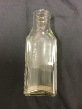 Clear Glass bottle, square shaped.