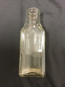 Clear Glass bottle, square shaped.