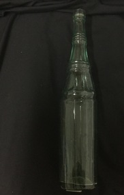 Glass, brown medicinal bottle.  'Warners Safe Cure' imprinted on bottle.