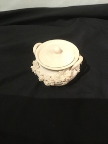 White Pottery bowl with lid - grape ornamentation on bowl.