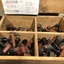 A partitioned wooden box containing various fruit variety and number Rubber Stamps.