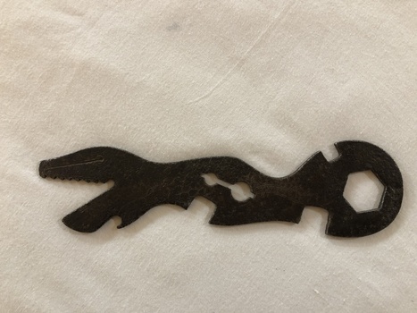 Steel multi-purpose bicycle spanner, including a bottle opener. Known as an Alligator (U.S.) or Crocodile spanner (U.K.) because of the serrated jaw. 