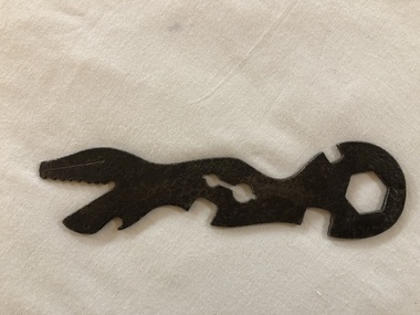 Steel multi-purpose bicycle spanner, including a bottle opener. Known as an Alligator (U.S.) or Crocodile spanner (U.K.) because of the serrated jaw. 