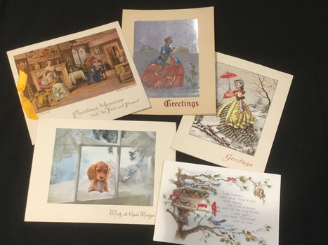 Five assorted colourful Christmas cards.