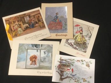 Five assorted colourful Christmas cards.