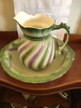 Large bedroom jug and basin set, white ceramic with green and lilac striped pattern in wavy lines.