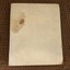 The cream covered book has the title The Progress Book in gold lettering on the front.