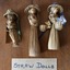 A set of nine handmade clothed dolls from corn husks, pegs, straw and wood.