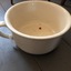 Cream bed pan with one handle, with red mark on base.