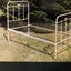 Iron single bed has bed head, bed base and bed end. One complete unit.