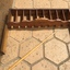  Handmade wooden table game has nine numbered holes at the bottom and slots behind and a wooden cue stick. 