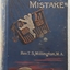 The cover has gold lettering for the title on a blue background with a picture of a boy climbing into a hot air balloon basket.