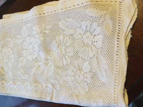 White cotton broderie anglaise curtain with feature embroidery, cutwork and needle lace. 