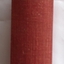 Plain red hardcover novel with no title shown on tbe front. Spine has title, author and publisher