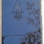 Small decorated book with black floral pattern on front and back covers. The title is in a gold box on the front as wdll as the word IllustrteIllustrated 