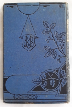 Small decorated book with black floral pattern on front and back covers. The title is in a gold box on the front as wdll as the word IllustrteIllustrated 
