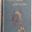 The blue cover shows a gold, black and red picture of a man lowering a young boy from a house fire tied in a sheet. The title Gentleman Jackson is printed in gold lettering.