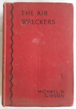 The red front cover shows the title The Air Wreckers by Michael D. Gibson in black lettering with two zigzag lines along the left side.   