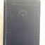 A thick blue covered New Standard Cookery Illustrated book with an engraved patterned front cover and gold lettering on spine.