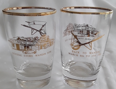 A pair of drinking glasses with gold trim to commemorate Back to Wandin 9th March to 12th March 1984