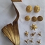 A set of 10 rolled gold stars, 5 buttons and a piece of gold thread ribbon for wearing on a German military uniform in WW1.