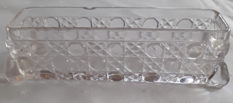 A small rectangular Windsor cut glass container used in the bedroom.