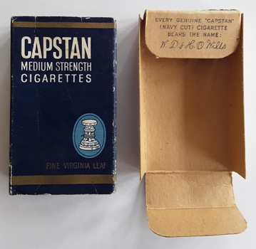 A blue and gold packet with white lettering - Capstan Medium Strength Cigarettes.