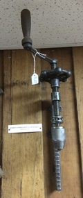 A combination clamp and drill hand tool used in carpentry,  late 19th or early 20th Century