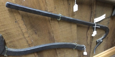A vintage cast iron tool used to pull nails out of timber.