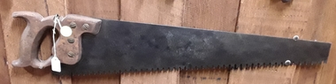 A wooden handled 'steel M' toothed hand saw used to saw rough wood.