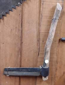 A steel bladed wooden handled Shingle Splitter used for splitting timber.