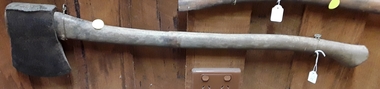 A wooden handled steel forged axe in reasonable condition.