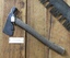 A forged steel casing hatchet with a wooden handle