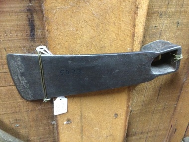 A forged steel curved long blade headed adze. 