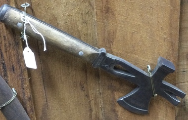 A metal headed hatchet with an axe area, hammer  head and lever. 