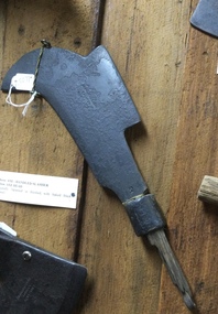 An axe handled slasher  used to cut back scrub.