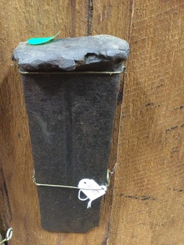 A solid steel wedge used to split timber and logs.