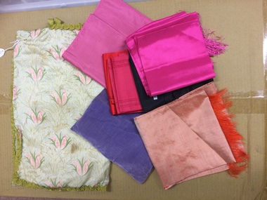 Carry all containing a selection of scarves. 