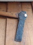 An axe used for cutting holes in wooden posts where wooden rails are fitted.