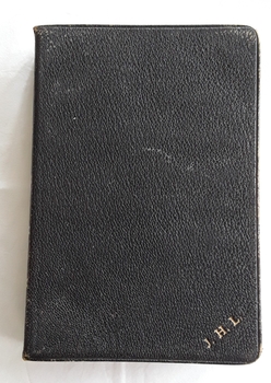 A black leatherette softcover Holy Bible contains the Old and New Testaments and a prayer book