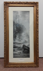 A rectangular ornate gold framed black and white photographic print of the Douglas Head Lighthouse.