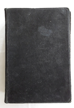 A black hardcover Holy Bible - Revised Version