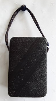 Two miniature black leatherette religious books in a matching carry case.