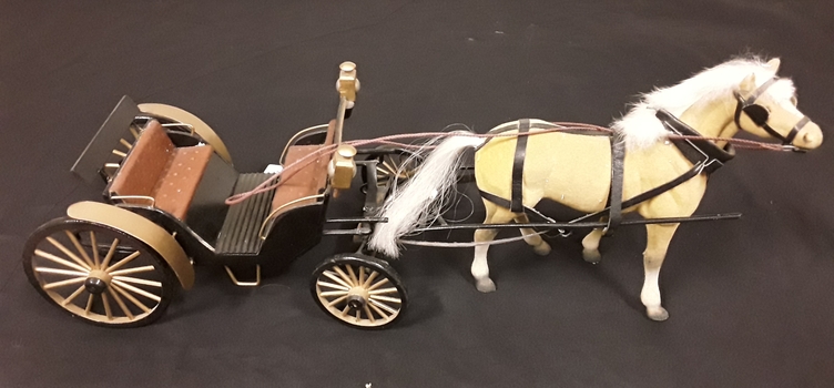 A model of a Hampden buggy and horse, c1900. The body is low to the ground, making it easy for passengers to board and disembark. 