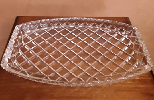 A rectangular cut glass tray with curved long sides.