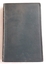 A dark green hardcover plant and weed book with a self embossed pattern and lines around the edges of the covers. 
