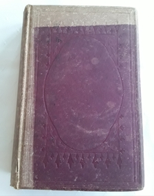 A faded, damaged burgundy colour hardcover book with an embossed self pattern.