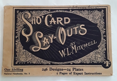 A light tan small rectangular paperback handbook: Sho' card Lay-outs. 