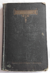 A damaged dark green fabric covered book of Tennyson's Poems with the title printed in gold on the front cover.