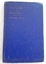 A small blue hardcover book with the title printed in gold lettering at the top of the front cover -The Care of Infants.